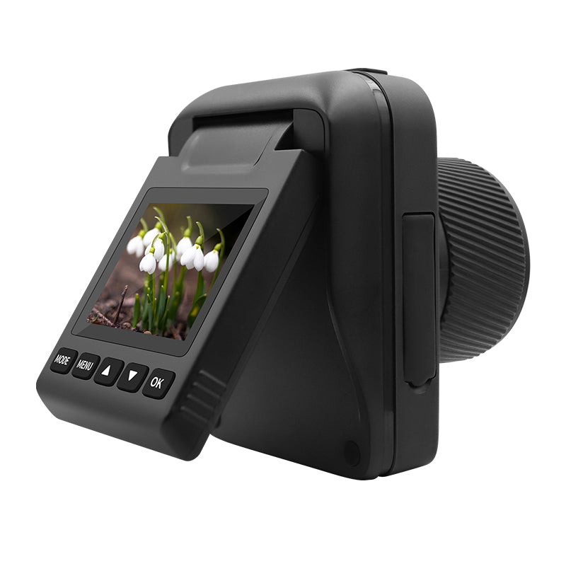 Black digital camera with large lens and flip-out screen displaying a close-up photo of white flowers.